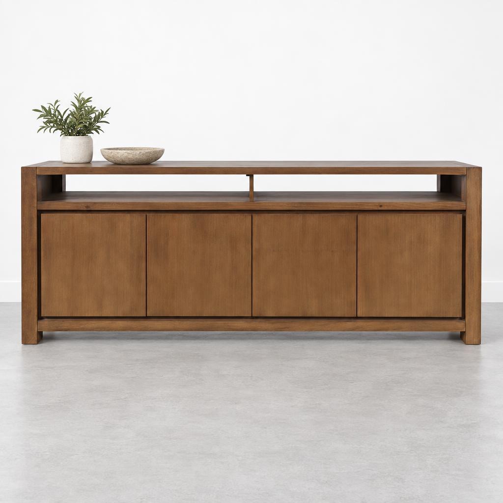 Wooden console table with plants and bowl on top.
