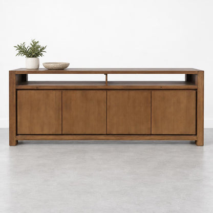 Wooden console table with plants and bowl on top.