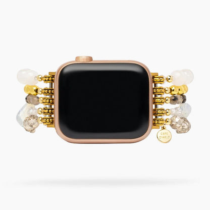 Smartwatch with a beaded, gold-accented strap.