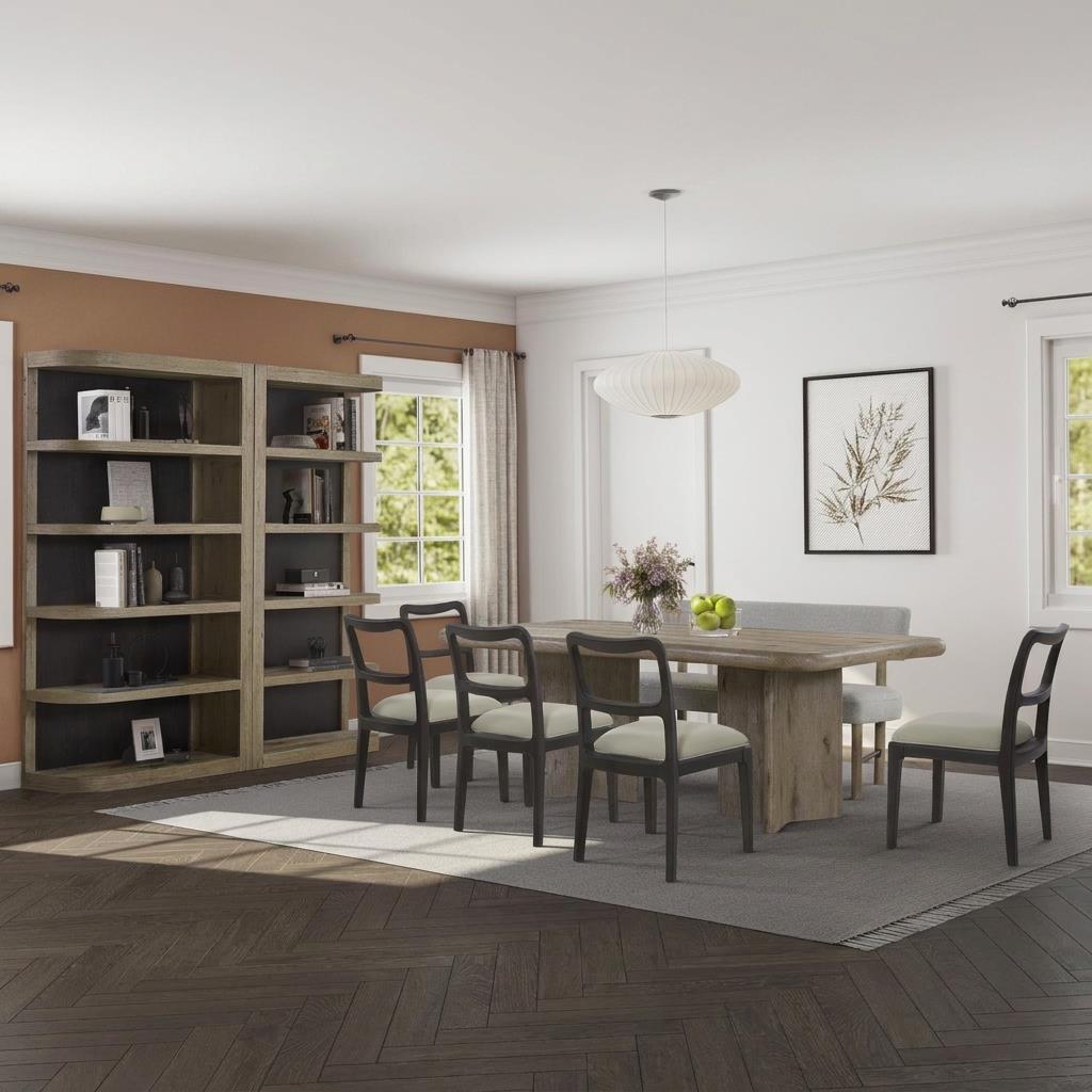 Modern dining room with table, chairs, and large bookshelf.