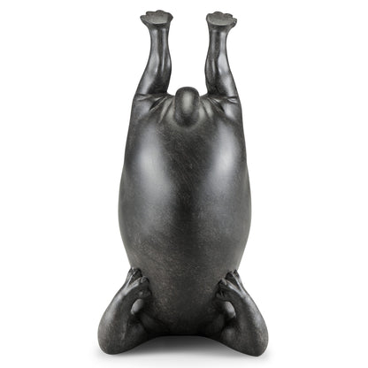 Abstract sculpture of a headstanding figure.