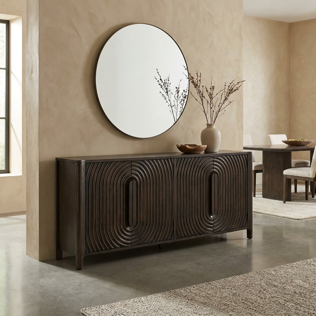 Dark wooden credenza with curved, textured patterns.