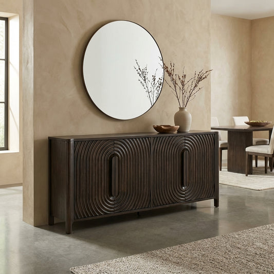 Dark wooden credenza with curved, textured patterns.