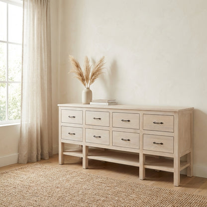 Light wood dresser with eight drawers, one slightly open.