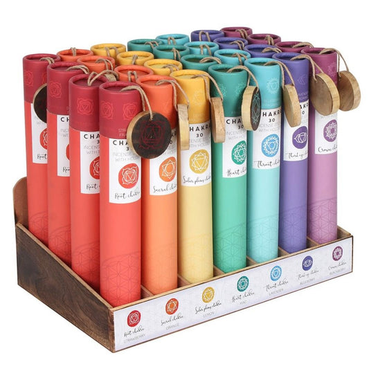 Colorful incense tubes for each chakra in a wooden display box.