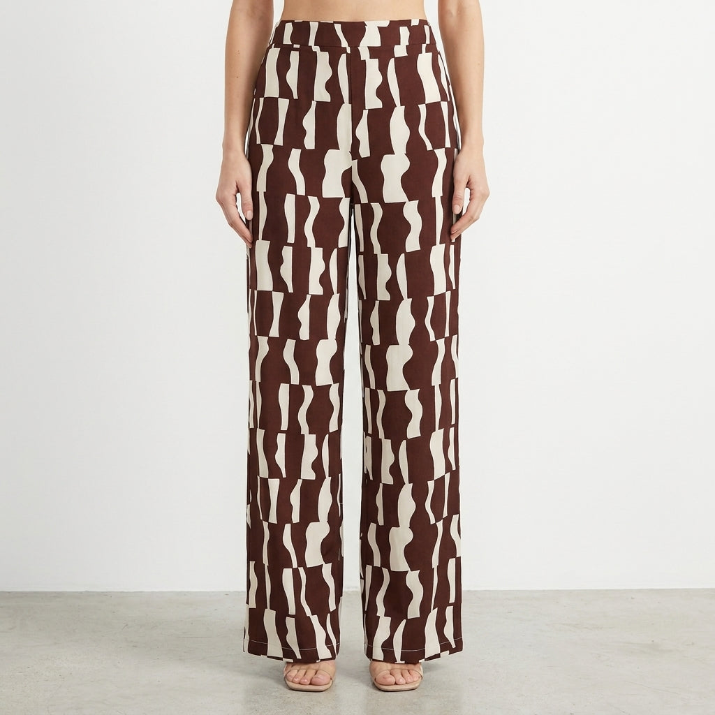 Brown and white patterned wide-leg pants on a model.