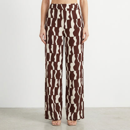 Brown and white patterned wide-leg pants on a model.