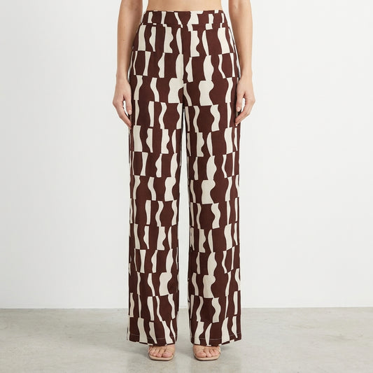 Brown and white patterned wide-leg pants on a model.