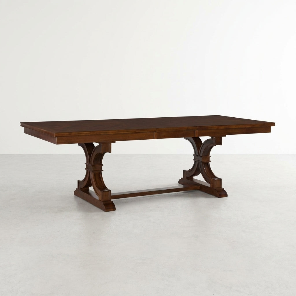 Wooden dining table with ornate trestle legs on a white background.