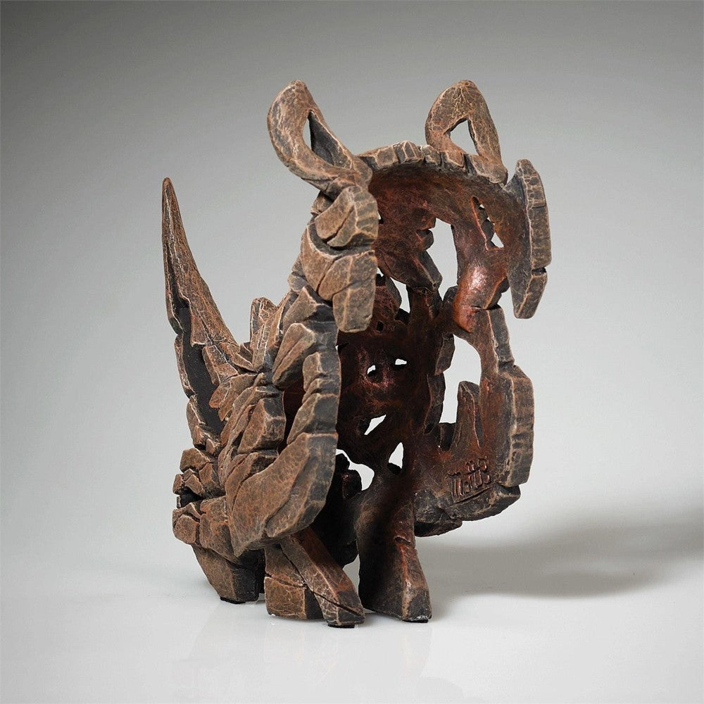 Abstract wooden sculpture with intricate, organic shapes.