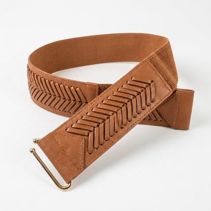 Brown leather guitar strap with textured patterns and gold hardware.
