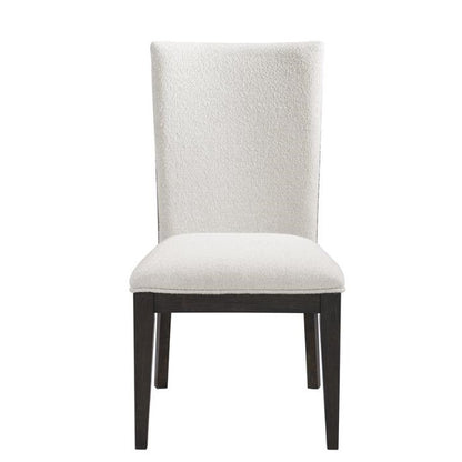 White upholstered chair with dark wooden legs.
