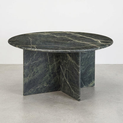 Round marble table with a dark green texture.