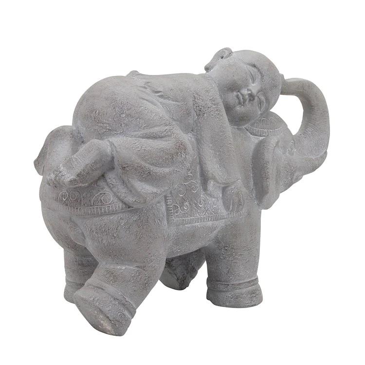 Picture of Child Riding on Elephant Statue