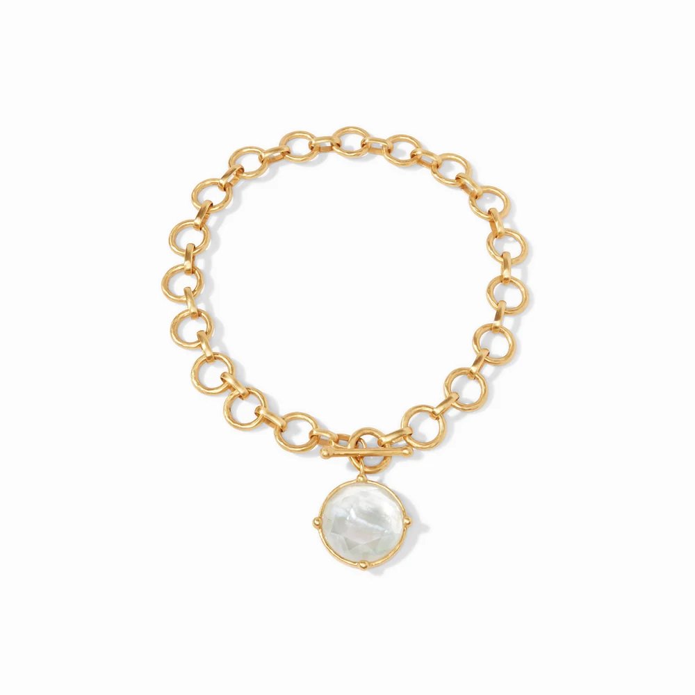 Gold link bracelet with round crystal charm.