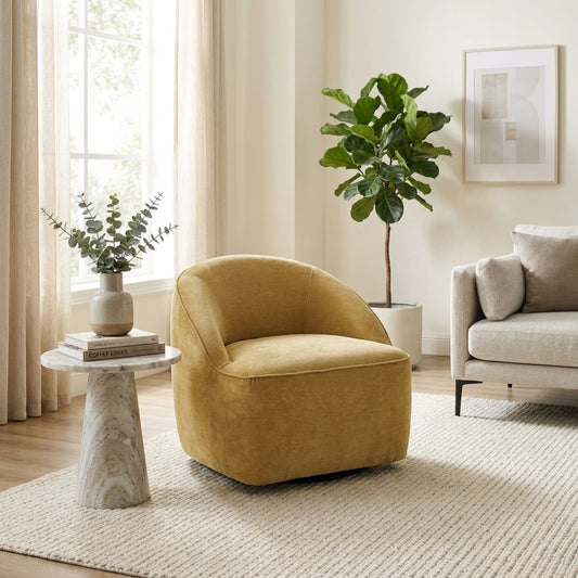 Mustard-colored, modern, rounded armchair with a velvet texture.