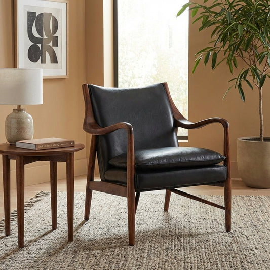 Mid-century modern chair with wooden frame and black leather cushions.