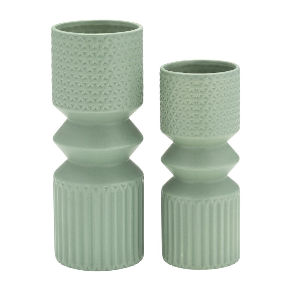 Two green textured vases, one taller than the other.