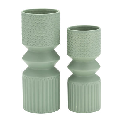 Two green textured vases, one taller than the other.