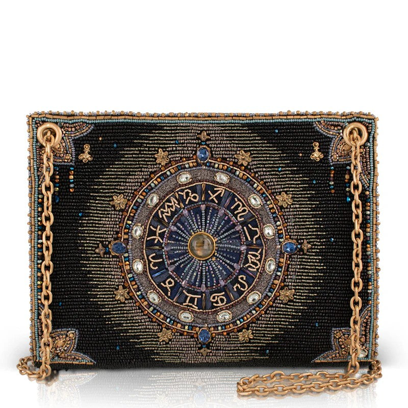 Intricate beaded clutch with zodiac design and gold chain.