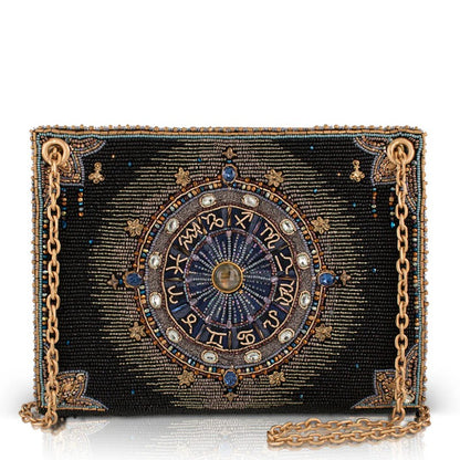 Intricate beaded clutch with zodiac design and gold chain.