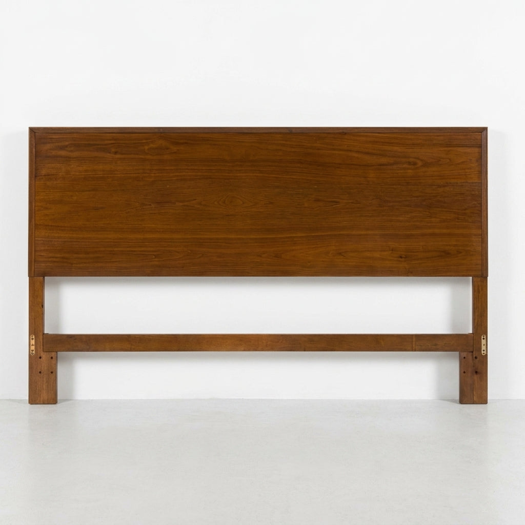 Wooden headboard with a minimalist design.