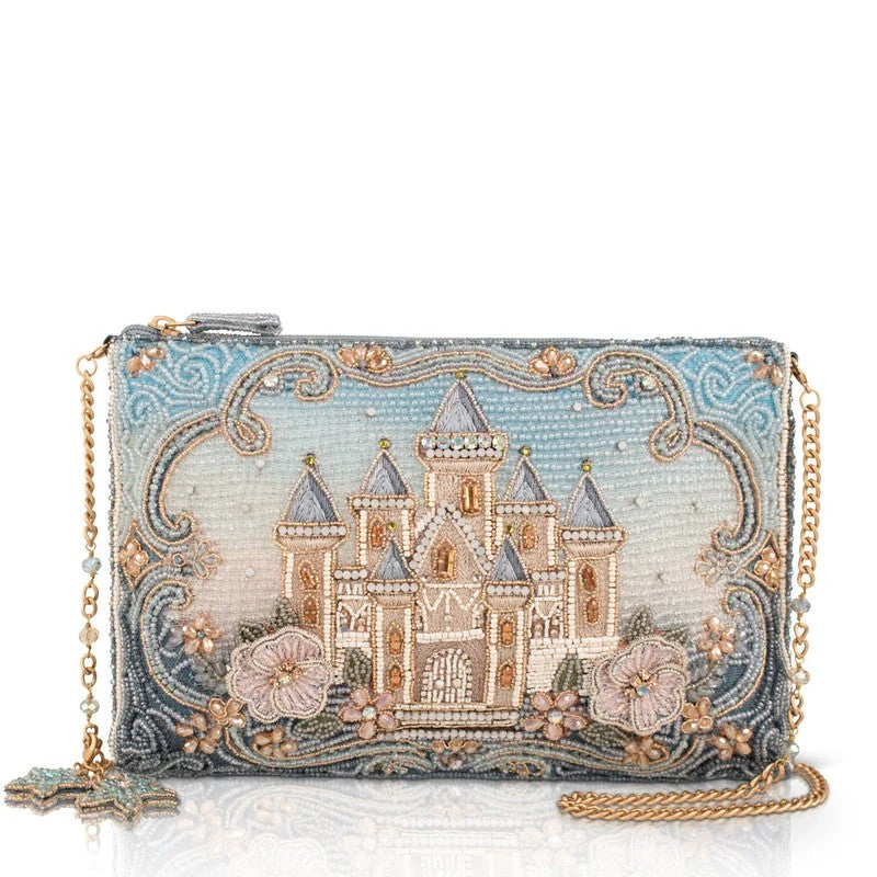 Beaded clutch with a castle design and gold chain.