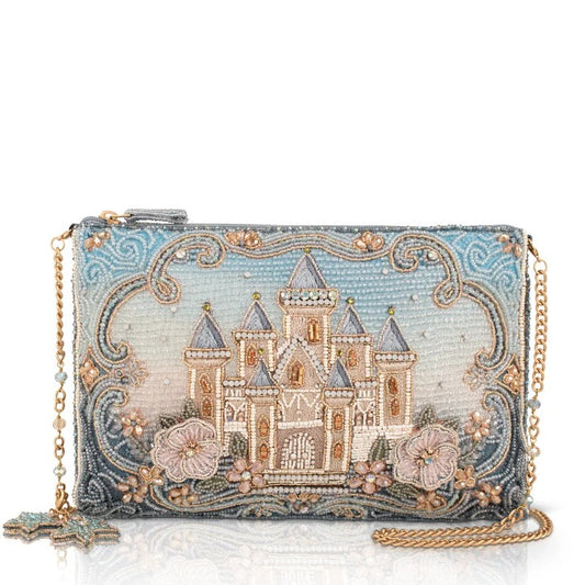 Beaded clutch with a castle design and gold chain.