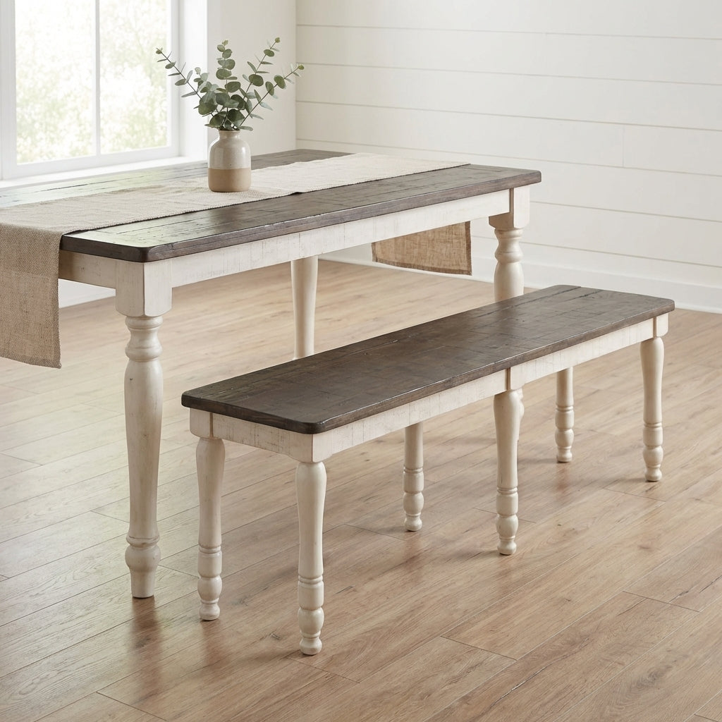A rustic bench with a dark wood top and white, turned legs.