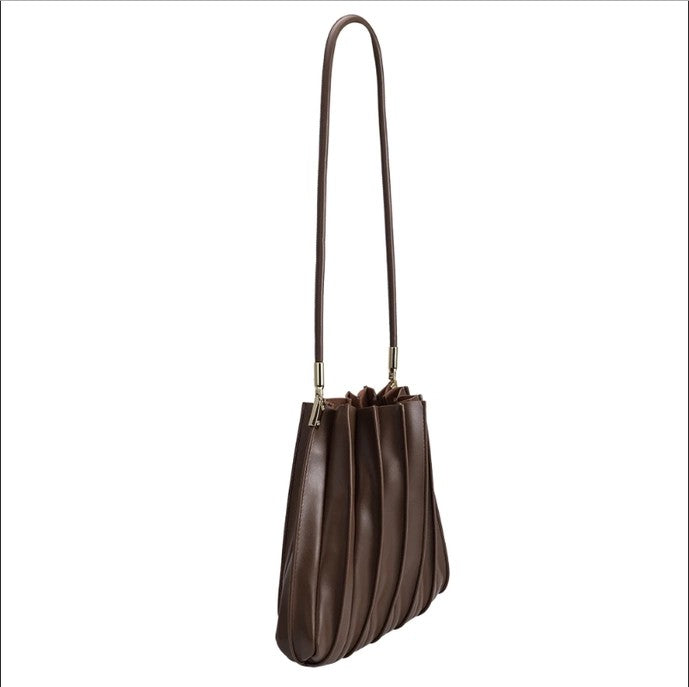 Brown pleated handbag with a long strap.