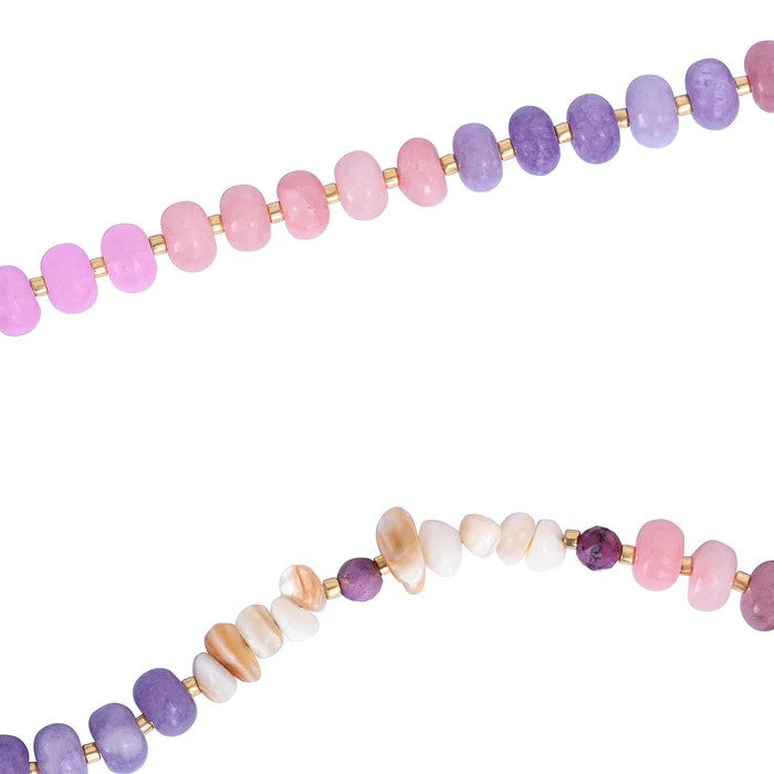 Colorful beaded necklaces with pink, purple, and white stones.