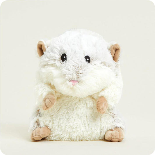 Fluffy hamster plush toy with cute features.