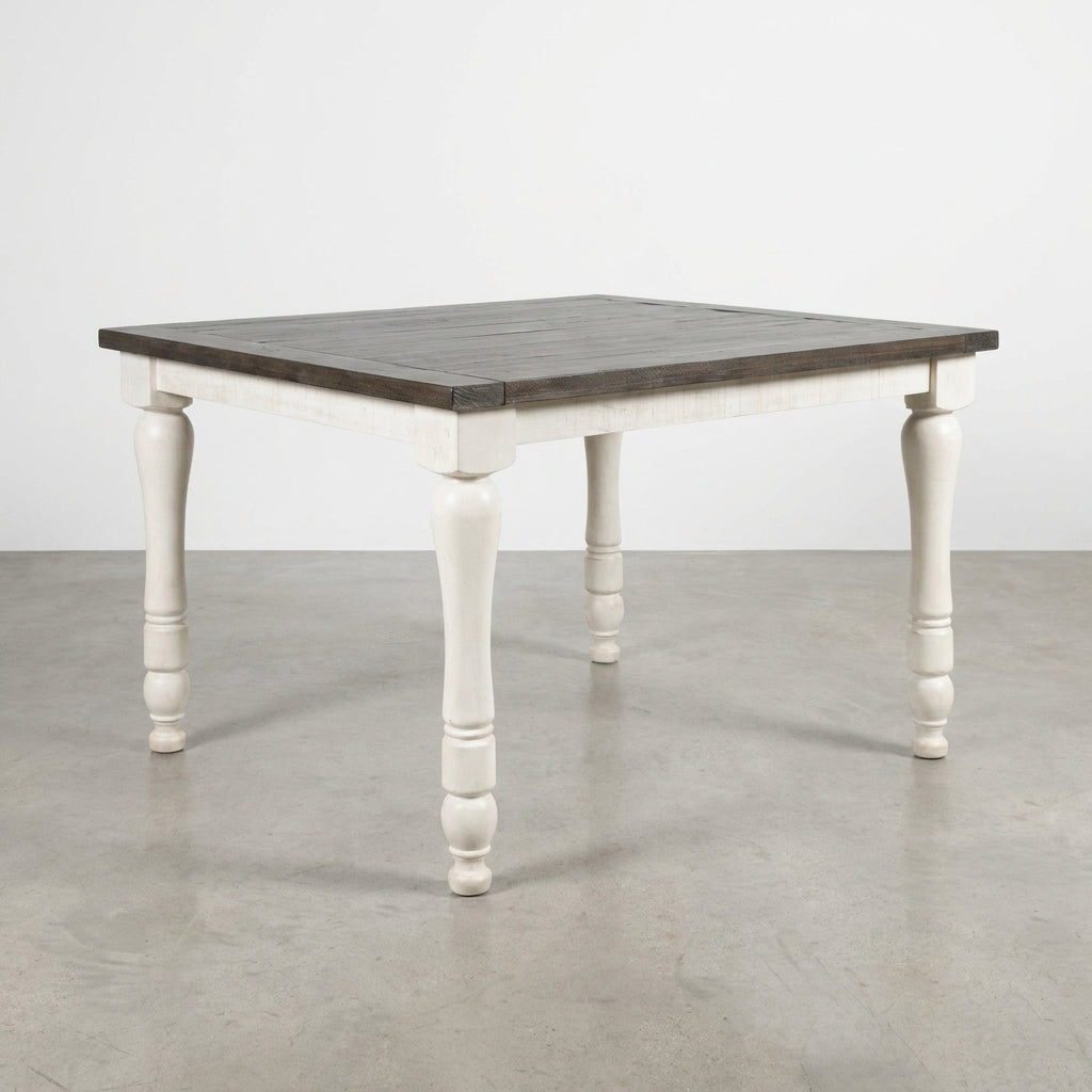 White wooden dining table with dark top.