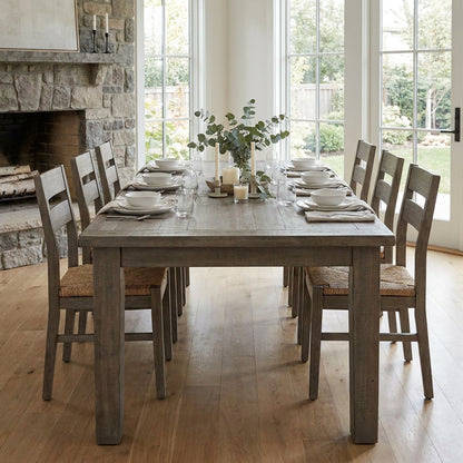 Gray wooden dining table against a white background.