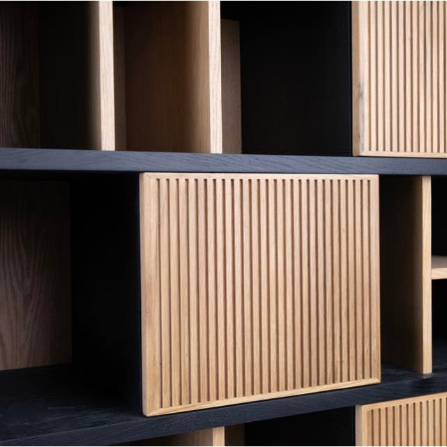 Wooden shelves with vertical slatted panel details.