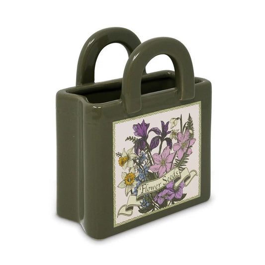 Green vase with handles and floral "Flower Seeds" label.