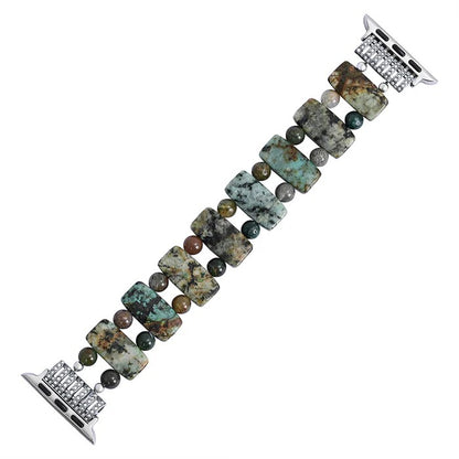 Beaded stone bracelet with rectangular and round elements on metal clasp.