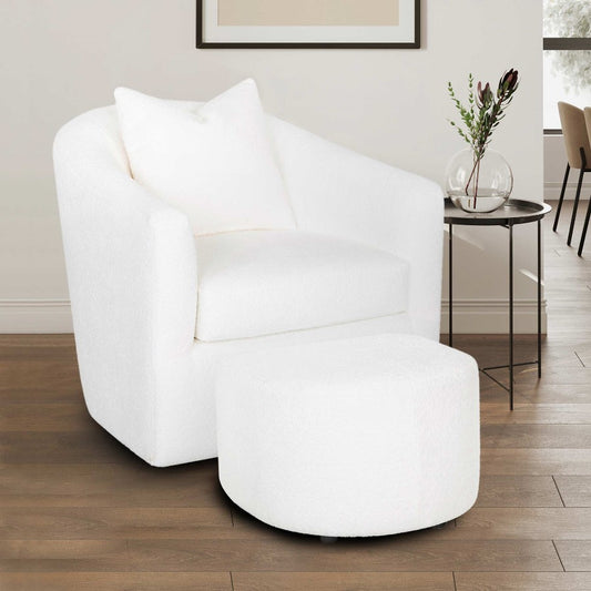 White armchair with ottoman and cushion.