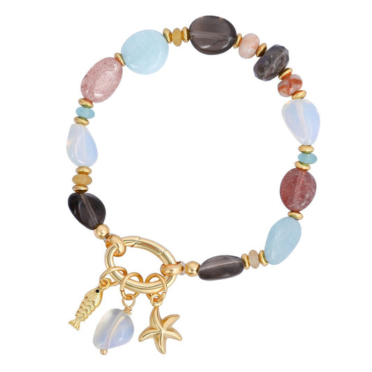 Colorful beaded bracelet with gold charms: fish, starfish, and gemstone.