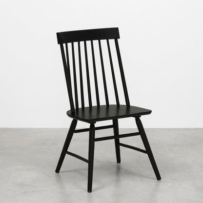 Black wooden chair with slatted backrest.