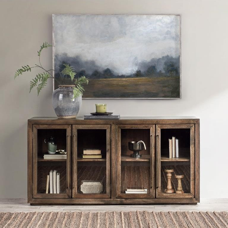 Wooden cabinet with four glass doors and brass handles.