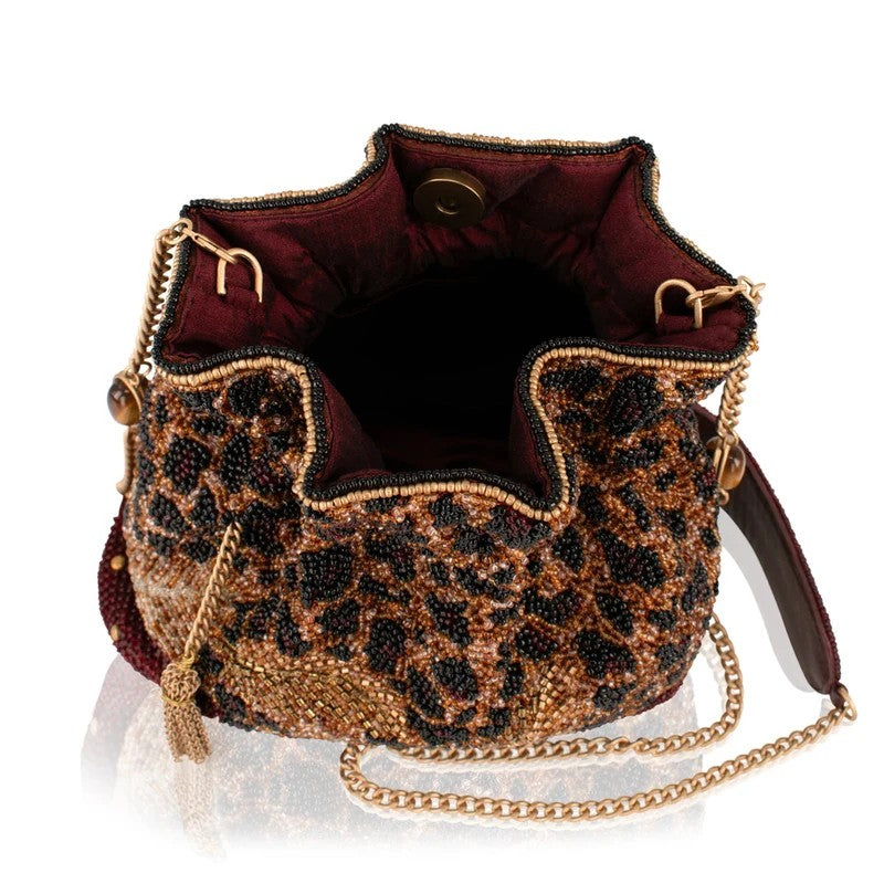 Beaded handbag with leopard print and gold chain strap.