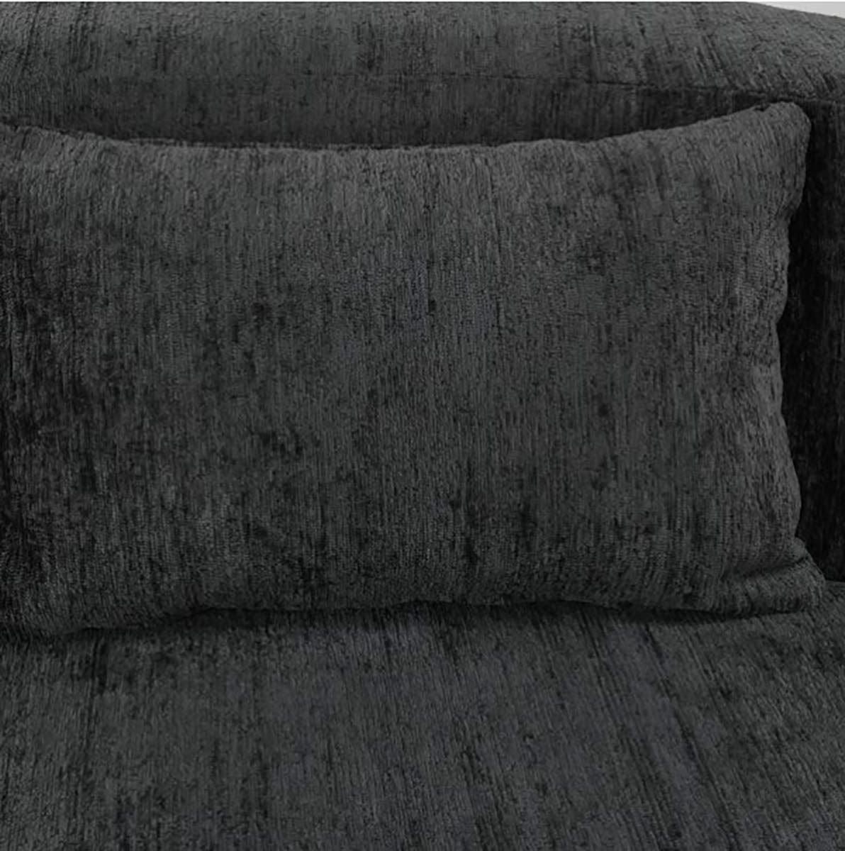 Dark textured sofa with large matching cushion.