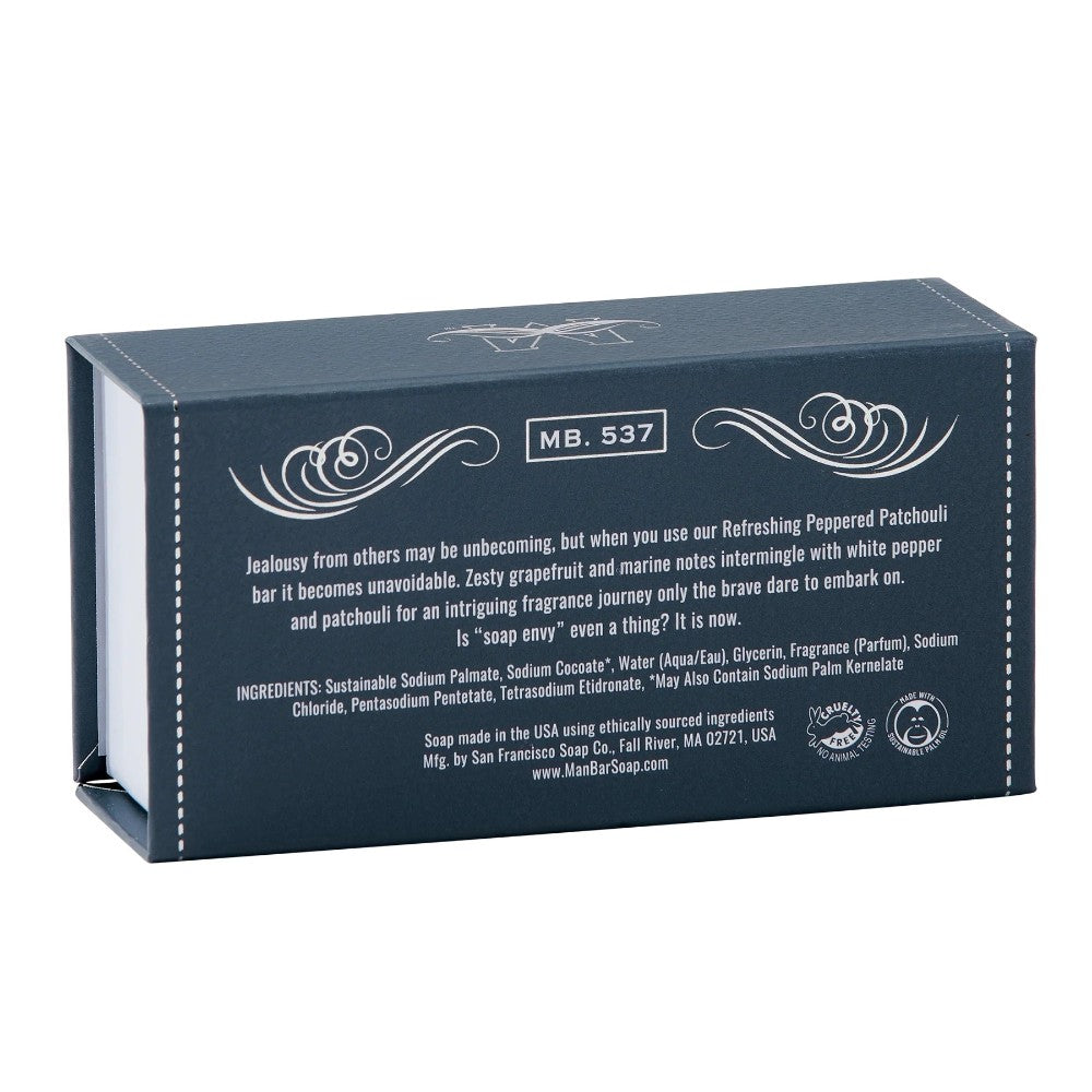 Dark blue soap box with text describing a bold fragrance journey.