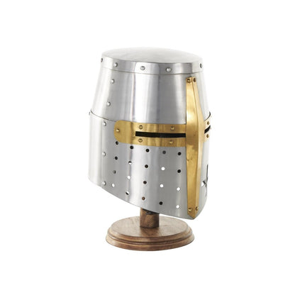 Medieval helmet with gold trim on a wooden stand.