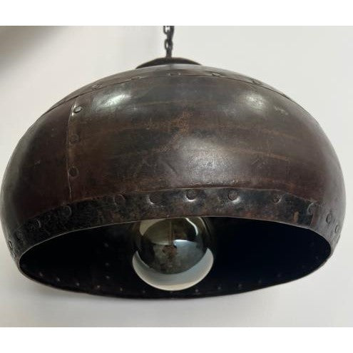 Vintage industrial-style metal pendant light fixture.