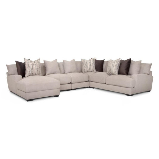 Beige sectional sofa with assorted pillows.