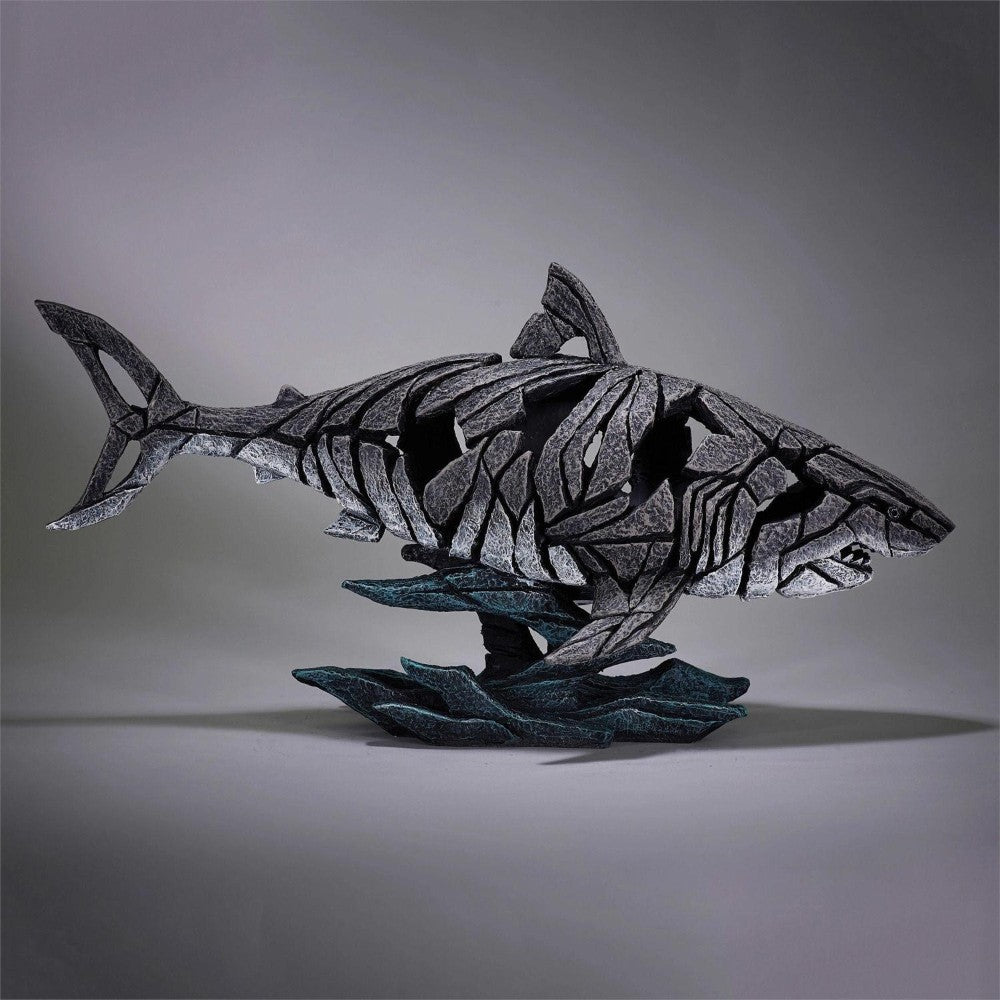 Abstract shark sculpture with intricate, fragmented design.