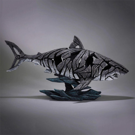 Abstract shark sculpture with intricate, fragmented design.