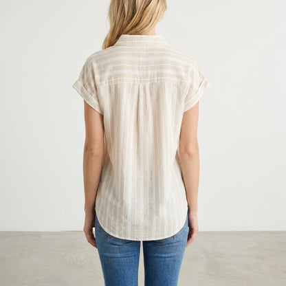 Person in striped shirt and jeans, facing away.